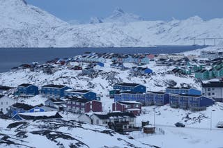 Residential apartment buildings stand among snow on January 21, 2026 in Nuuk, Greenland